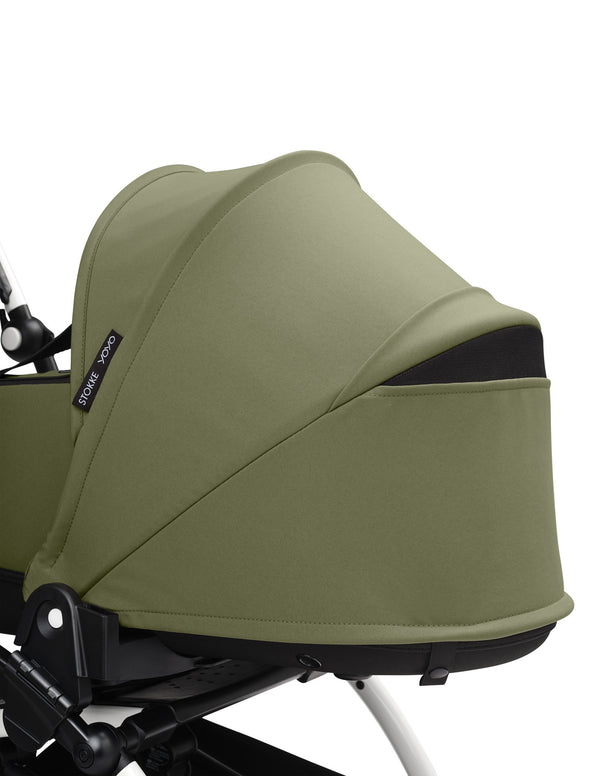 Alcofa STOKKE YOYO³ ultra leve e compacta, com colchão respirável, capota ventilada, cobre-pés, tecido impermeável com proteção UPF 50+ e compatível com o carrinho STOKKE YOYO³ para bebés desde o nascimento até aos 9 kg. Olive