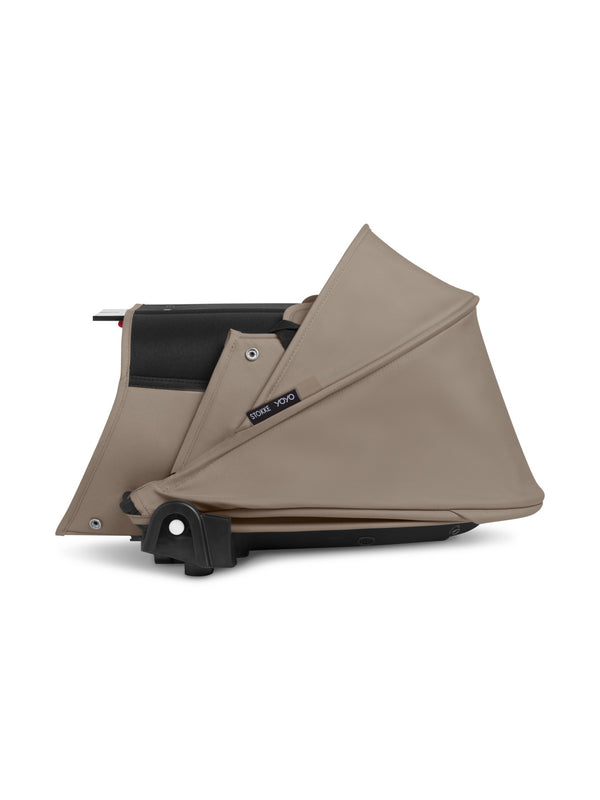 Alcofa STOKKE YOYO³ ultra leve e compacta, com colchão respirável, capota ventilada, cobre-pés, tecido impermeável com proteção UPF 50+ e compatível com o carrinho STOKKE YOYO³ para bebés desde o nascimento até aos 9 kg. Taupe