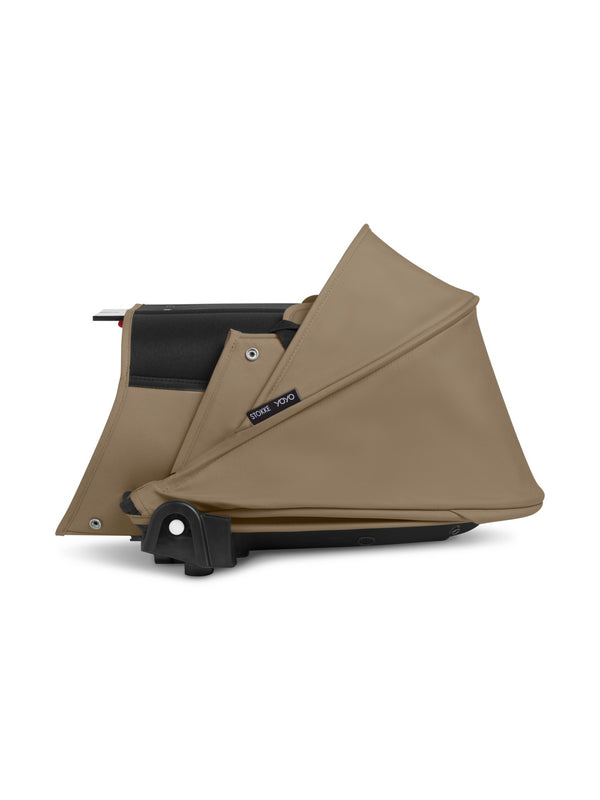 Alcofa STOKKE YOYO³ ultra leve e compacta, com colchão respirável, capota ventilada, cobre-pés, tecido impermeável com proteção UPF 50+ e compatível com o carrinho STOKKE YOYO³ para bebés desde o nascimento até aos 9 kg. Toffee