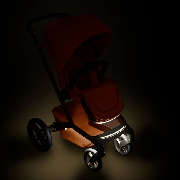 Carrinho Maxi-Cosi Fame com assento reclinável, sistema LumiRide LED, suspensão CosiCruise, apoio de braços e compatibilidade com cadeiras auto SlideTech® copper terra