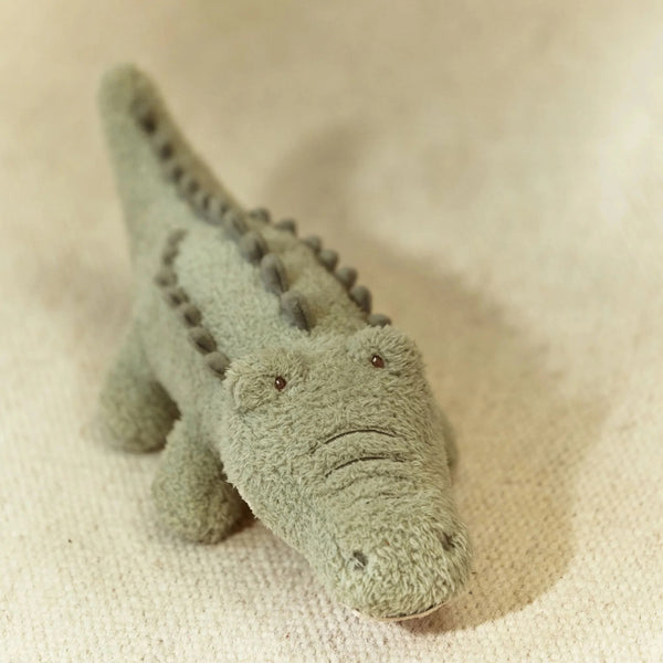 Peluche Crocodilo Safari Friends em poliéster macio, com diferentes texturas e detalhes divertidos, adequado para bebés desde o nascimento.