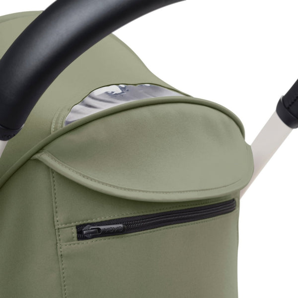 Carrinho Stokke YOYO³ compacto e ultraleve ideal para viagens e cabine de avião estrutura preta cor olive