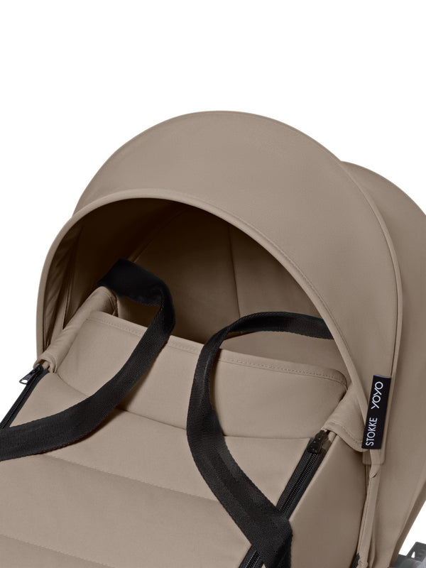 Alcofa STOKKE YOYO³ ultra leve e compacta, com colchão respirável, capota ventilada, cobre-pés, tecido impermeável com proteção UPF 50+ e compatível com o carrinho STOKKE YOYO³ para bebés desde o nascimento até aos 9 kg.Taupe