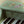 Piano de madeira Safari Friends com 11 teclas e melodias integradas, ideal para estimular a criatividade, o ritmo e a iniciação musical das crianças verde.