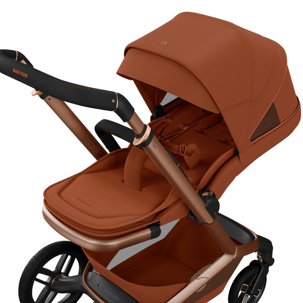 Carrinho Maxi-Cosi Fame com assento reclinável, sistema LumiRide LED, suspensão CosiCruise, apoio de braços e compatibilidade com cadeiras auto SlideTech® copper terra