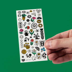 Folha de Flash Tattoos com 46 tatuagens temporárias em estilo rock'n'roll, fáceis de aplicar e remover, ideais para festas, festivais e momentos criativos. Flower Pop