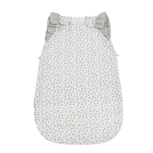 Saco de Dormir de Verão Little Bloom Pasito a Pasito em 100% algodão muselina TOG 0.5, ideal para manter o bebé fresco, confortável e seguro durante as noites quentes. Flowers Grey
