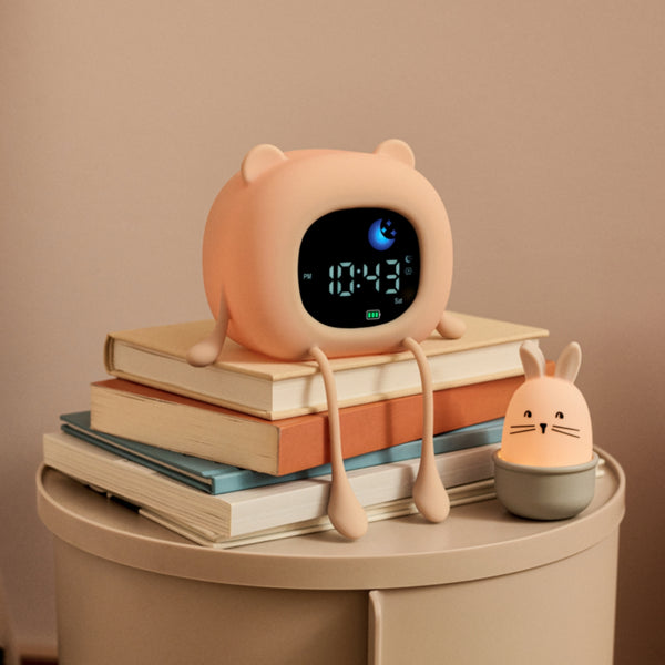 Relógio infantil Dani com alarme, luz de presença, sons relaxantes, modos nascer e pôr do sol e ecrã digital com horas e temperatura.