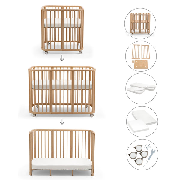 Stokke Nighti Convertible Cot Bed em madeira com colchões, lençóis e kit de extensão para bebé até aos 5 anos.