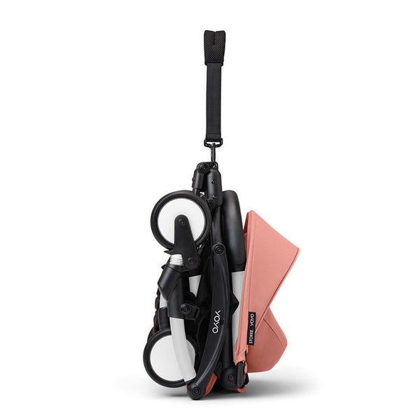 Carrinho Stokke YOYO³ compacto e ultraleve ideal para viagens e cabine de avião estrutura preta cor ginger